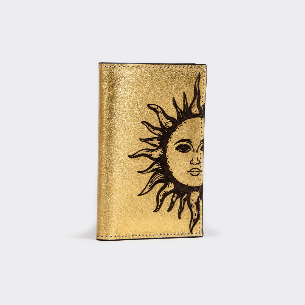 PORTA PASAPORTE SOL ORO